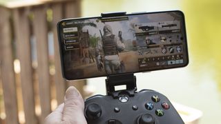 OnePlus 10T in landscape playing Call of Duty Mobile attached to an Xbox controller