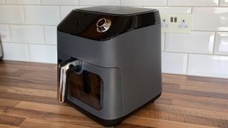 side view of the Kyvol AF600 Air Fryer on a kitchen countertop