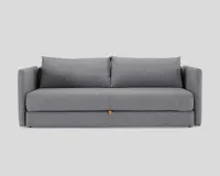 A contemporary grey sofa bed with a tan leather strap underneath the seat for transformation from sofa to bed