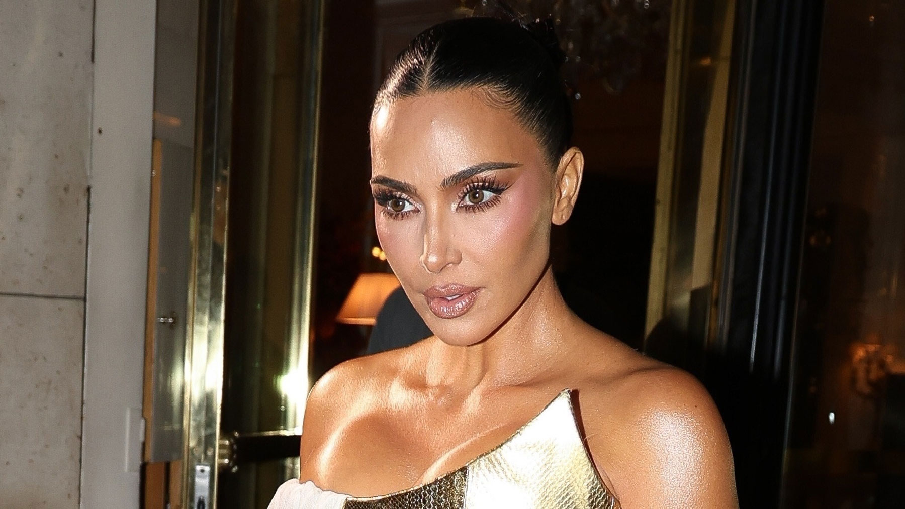 Kim Kardashian's 45th birthday dinner dress with a gold corset