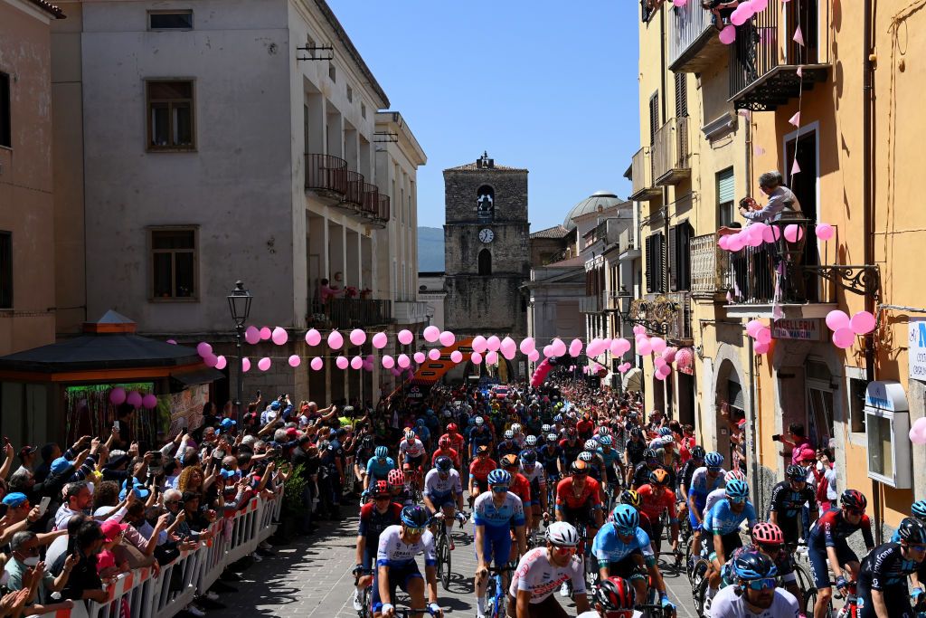 BLOCKHAUS ITALY MAY 15 A general view of the peloton passing through Isernia village at start prior to the 105th Giro dItalia 2022 Stage 9 a 191km stage from Isernia to Blockhaus 1664m Giro WorldTour on May 15 2022 in Blockhaus Italy Photo by Tim de WaeleGetty Images