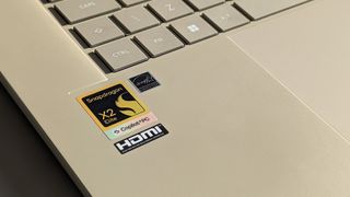 Snapdragon X2 Elite sticker with Copilot+ PC branding on ASUS Zenbook A16 laptop in Zabriskie Beige
