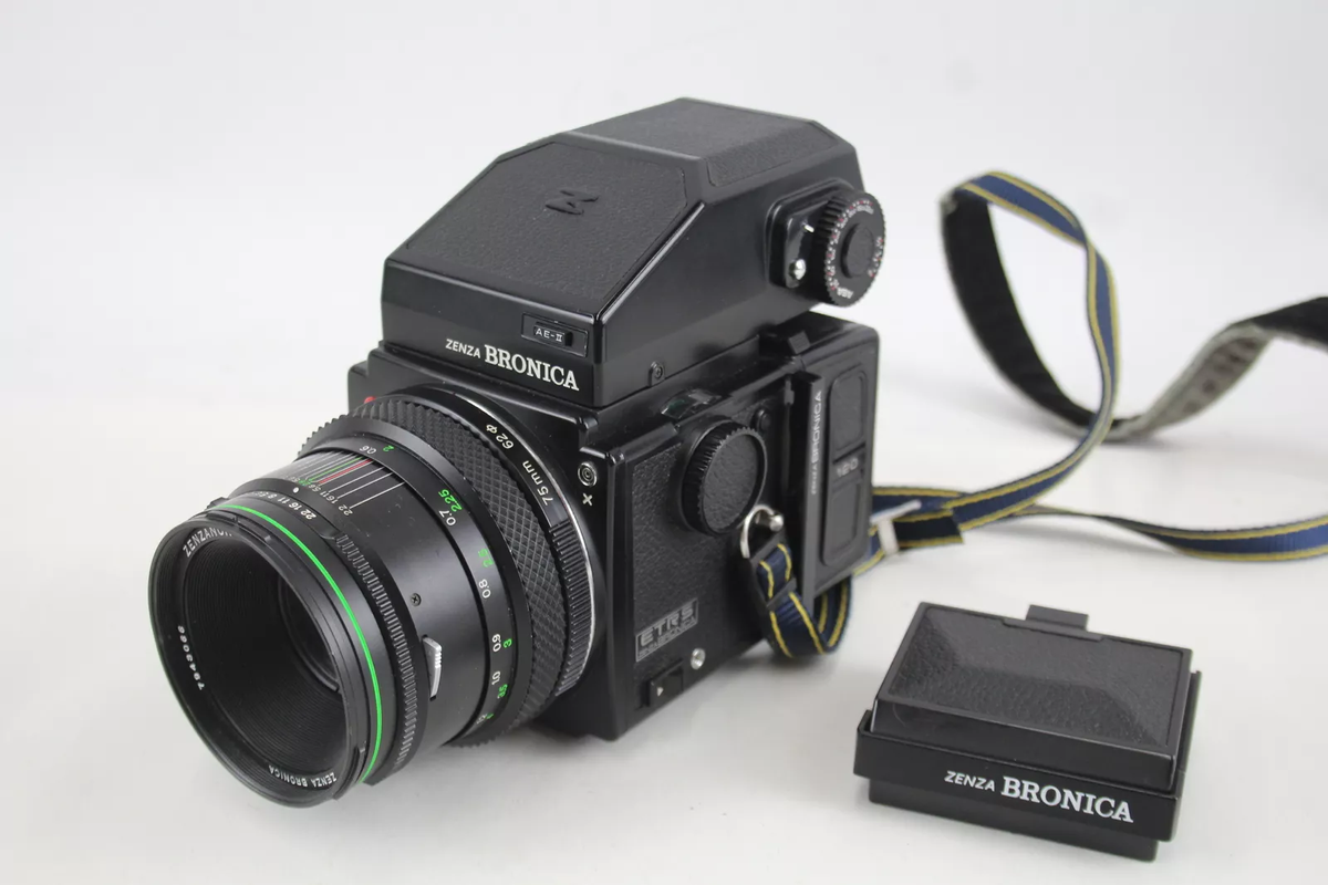 A selection of vintage cameras against a white background