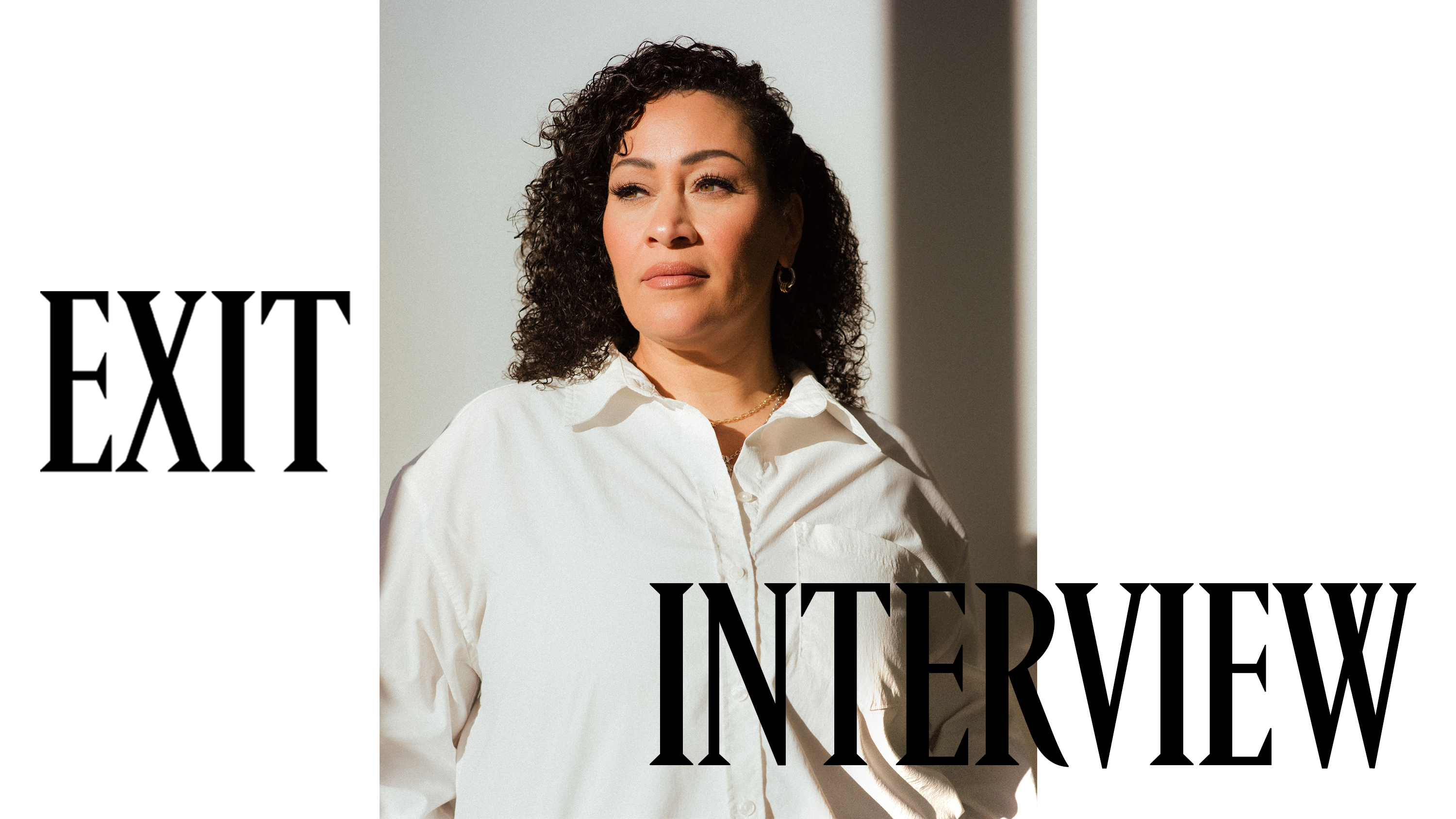 Image of Tania Flynn, Head of Design at Athleta, wearing a white button-down shirt.