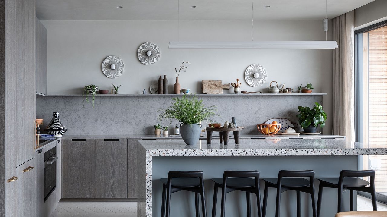 a kitchen with interesting wall sconces