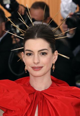 Anne Hathaway attends "Heavenly Bodies: Fashion & the Catholic Imagination", the 2018 Costume Institute Benefit at Metropolitan Museum of Art on May 7, 2018 in New York City