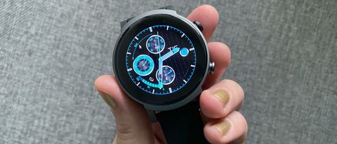 Woman's hand holding TicWatch E3, with an analog-style watch face