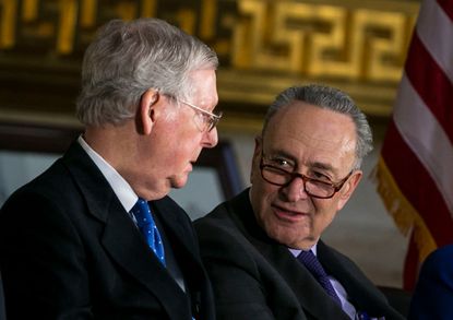 Senate Majority Leader Mitch McConnell (R-KY) (L) and Senate Minority Leader Chuck Schumer (D-NY) talk 