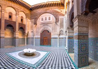 The elaborate tile inside the courtyard of Al-Attarine Medersa in Fez, Morocco