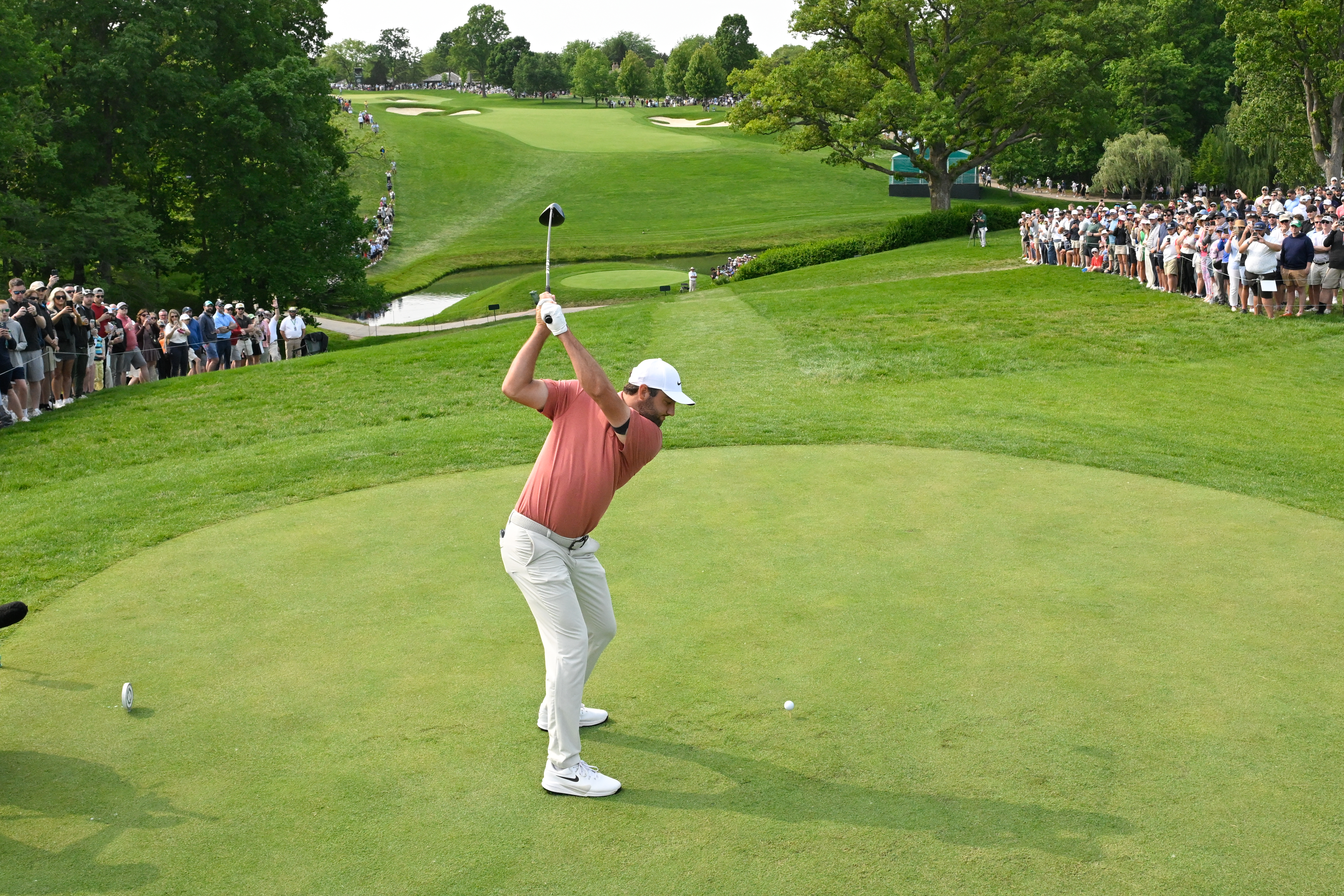 Scottie Scheffler at the top of his backswing with a driver
