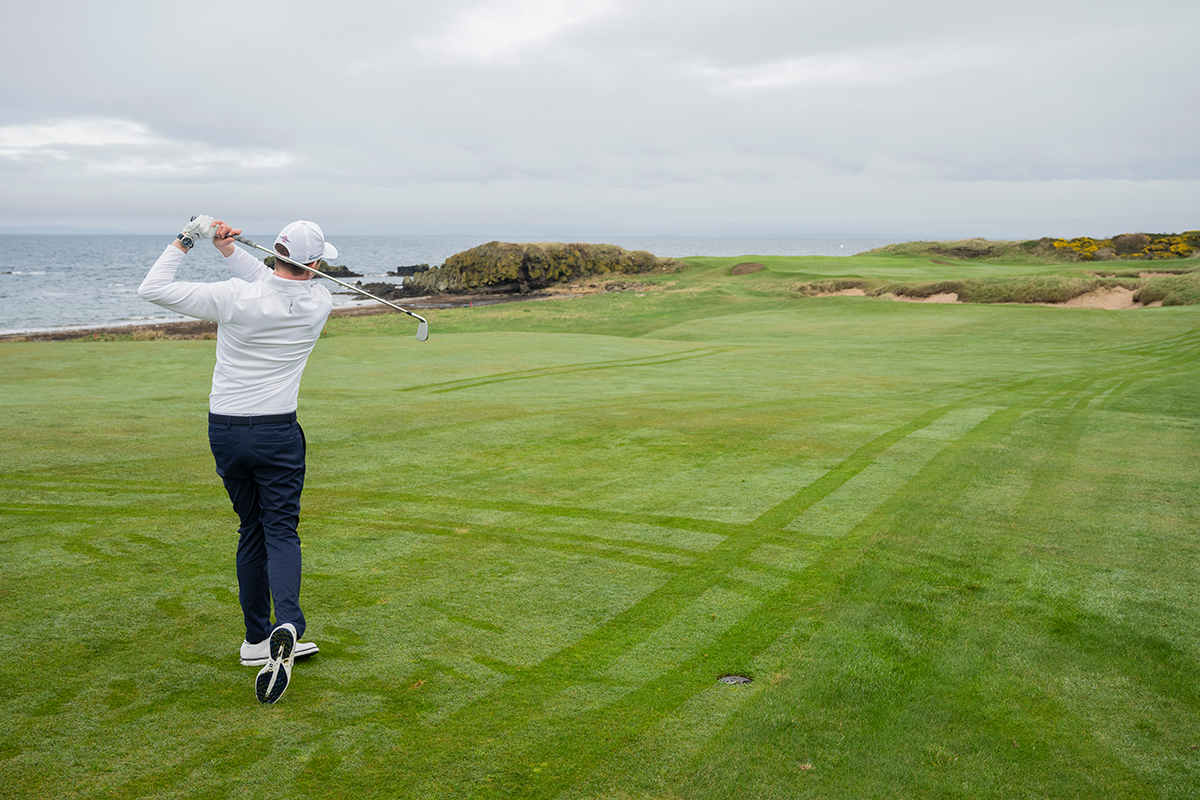 Ben Emerson hitting a knock down shot with an iron under the wind on the 10th hole at Trump Turnberry
