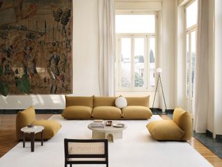 yellow arflex marenco sofa in a grand living room
