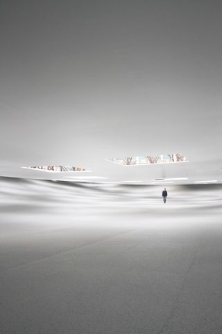 White interior of the KAIT pavilion with the floor and roof rising and falling