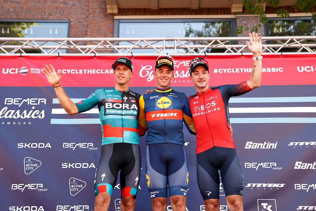 BEMER Cyclassics podium (l-r): second-place Danny Van Poppel (Bora Hansgrohe), winner Mads Pedersen (Lidl-Trek) and third-place Elia Viviani (Ineos Grenadiers)