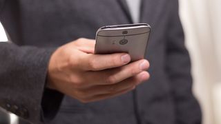 Close up of a business person using a smartphone.