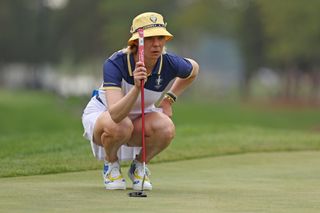 Madelene Sagstrom lines up a putt at the Solheim Cup