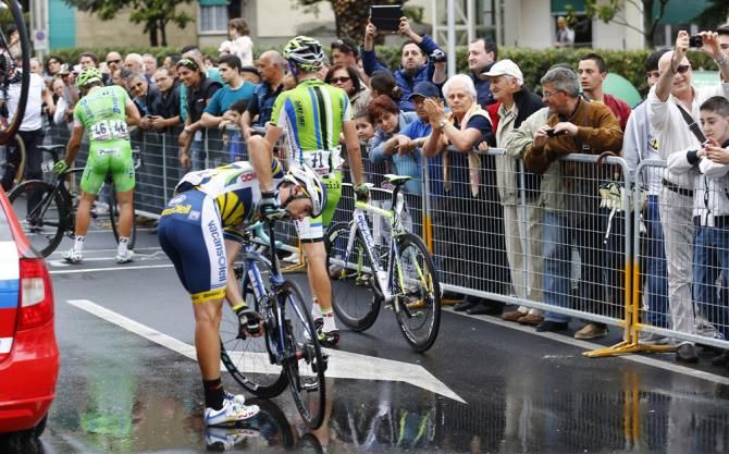 Marco Marcato (Vacansoleil-DCM), Damiano Caruso (Cannondale) and Sonny Colbrelli (Bardiani Valvole-CSF Inox) pick themselves up off the tarmac after crashing in the final turn