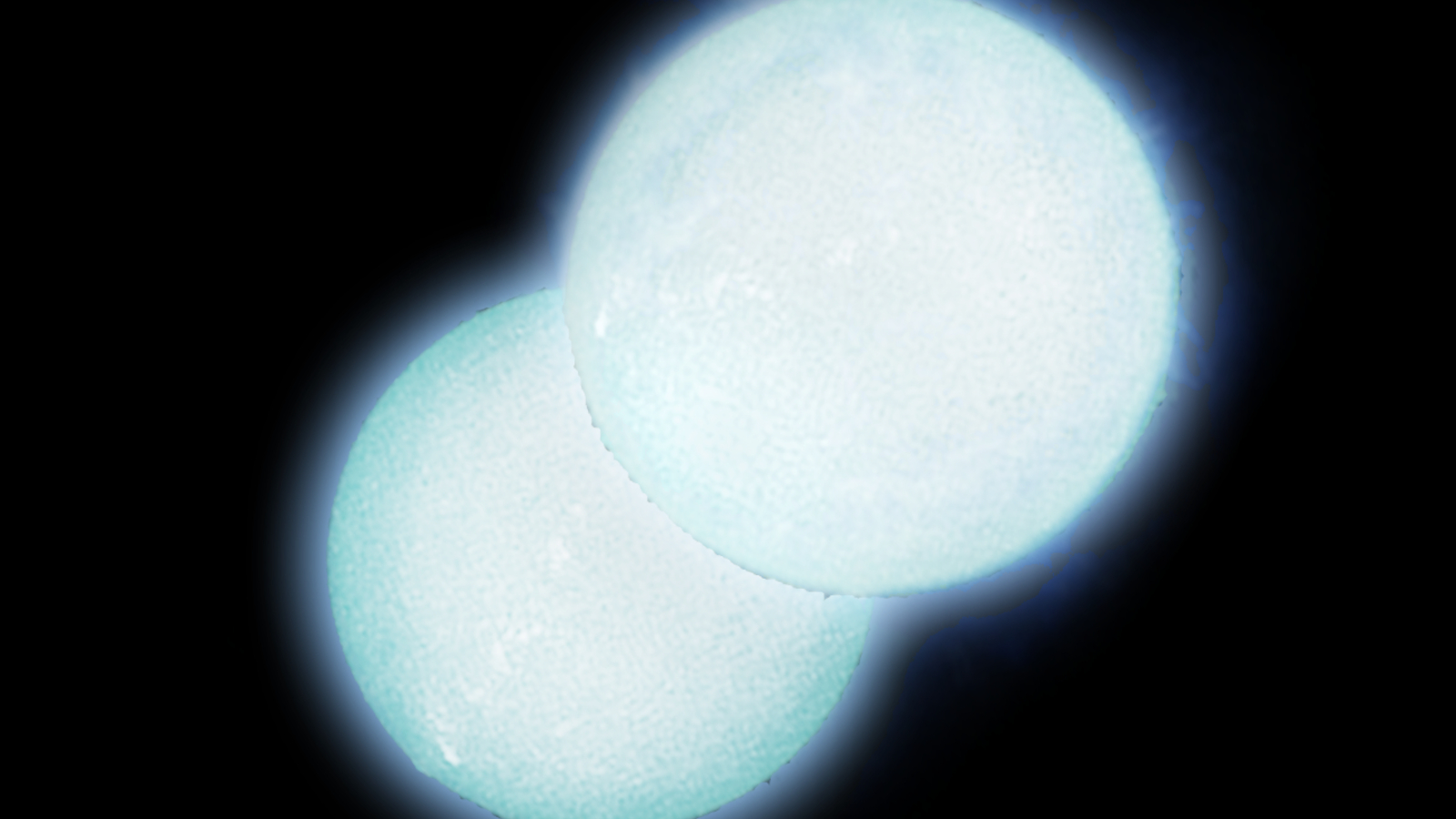 Two glowing balls sit next to each other against a dark screen