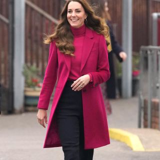 Britain's Catherine, Duchess of Cambridge gestures as she arrives for a visit to Nower Hill High School in Harrow, north London