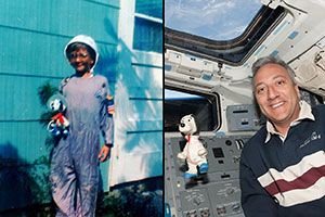Mike Massimino poses with his astronaut Snoopy toy in July 1969 and May 2009, the latter on space shuttle Atlantis.