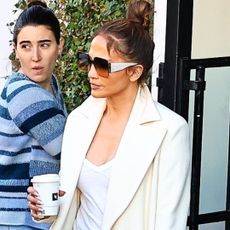 Jennifer Lopez in a white coat and rare Birkin bag while shopping in Los Angeles.