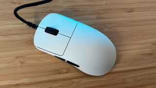 Top down view of Endgame Gear OP1 8K gaming mouse on a wooden desk