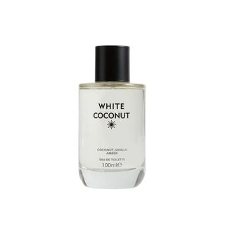 A clear 100ml perfume bottle labeled 'White Coconut', with a black cap. 