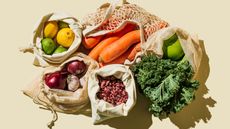 carrots, broccoli, and other groceries in sacks