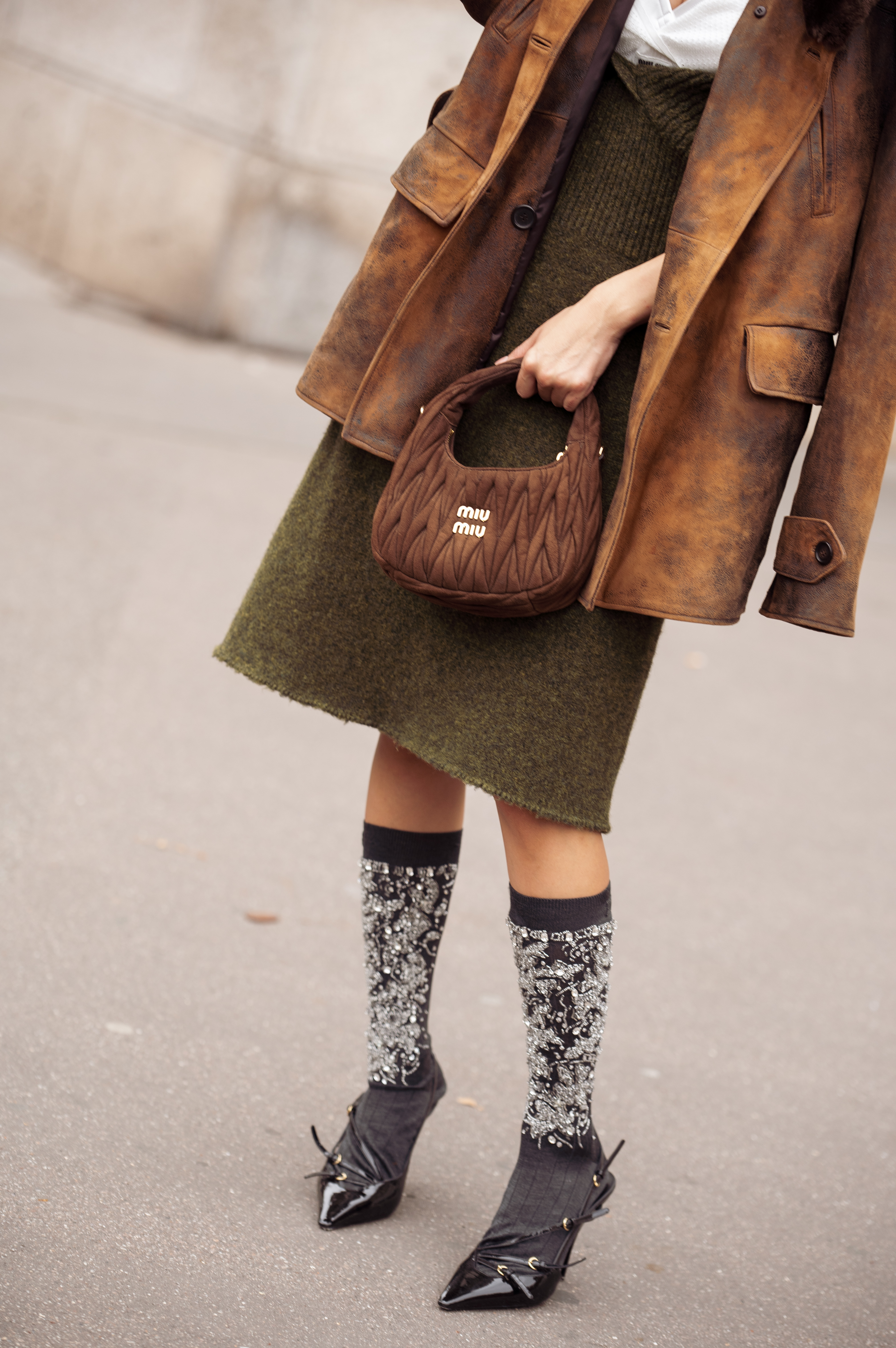 a street style star wears embellished socks during paris fashion week