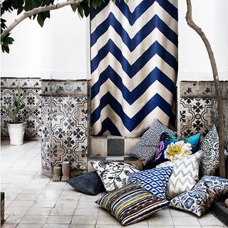 corner with patterned tiles and cushions