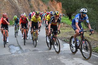 ALTODAFOIA PORTUGAL FEBRUARY 15 LR Sepp Kuss of The United States Wout Van Aert of Belgium and Team Visma Lease a Bike and Remco Evenepoel of Belgium and Team Soudal Quick Step compete during the 50th Volta ao Algarve em Bicicleta 2024 Stage 2 a 1719km stage from Lagoa to Alto da Foia 888m on February 15 2024 in Alto da Foia Portugal Photo by Dario BelingheriGetty Images