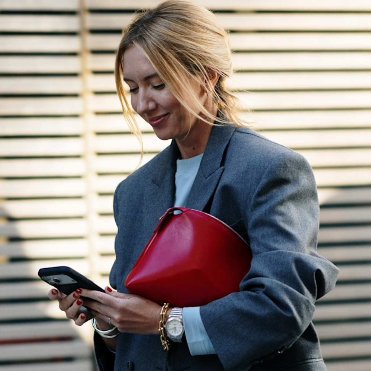 woman wearing a white t-shirt and a gray blazer