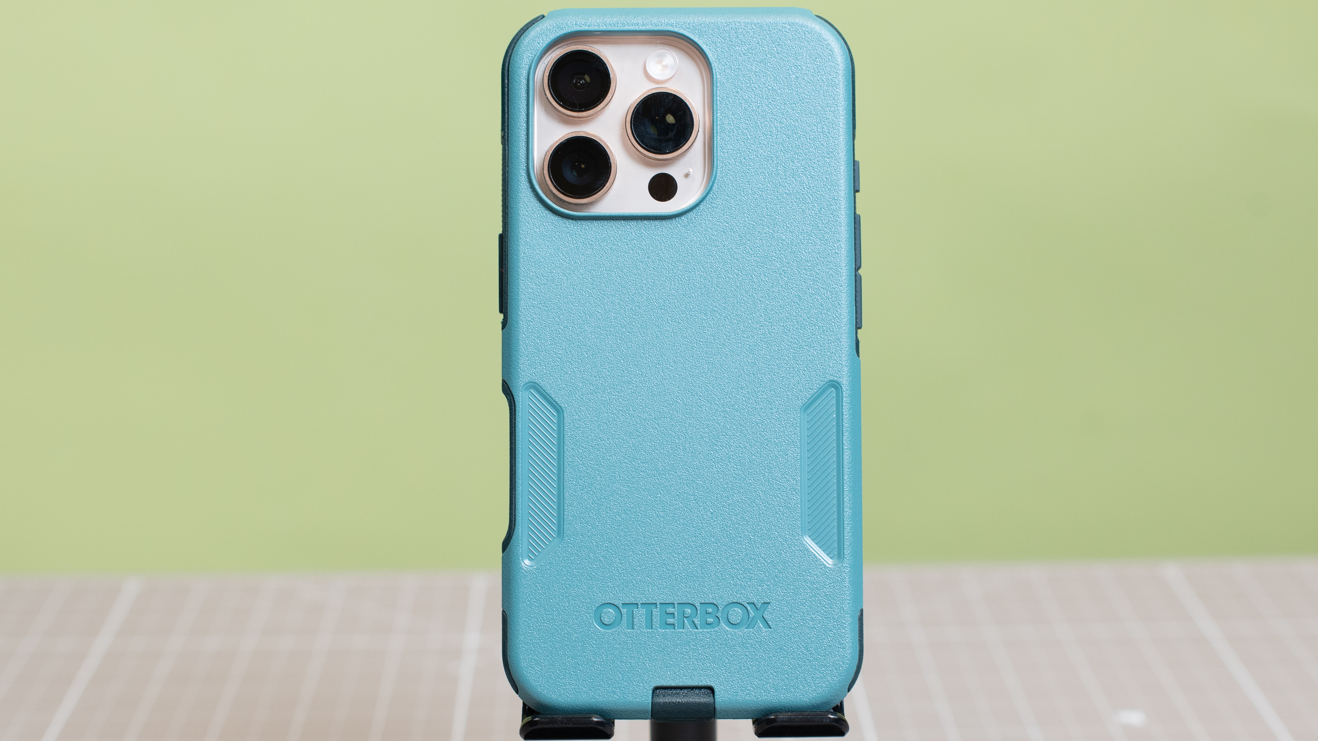 Otterbox Commuter Series in blue showing cameras from iPhone 16 Pro desert titanium inside