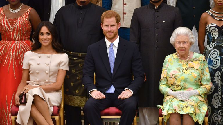 london, england june 26 meghan, duchess of sussex, prince harry, duke of sussex and queen elizabeth ii at the queens young leaders awards ceremony at buckingham palace on june 26, 2018 in london, england the queens young leaders programme, now in its fourth and final year, celebrates the achievements of young people from across the commonwealth working to improve the lives of people across a diverse range of issues including supporting people living with mental health problems, access to education, promoting gender equality, food scarcity and climate change photo by john stillwell wpa poolgetty images