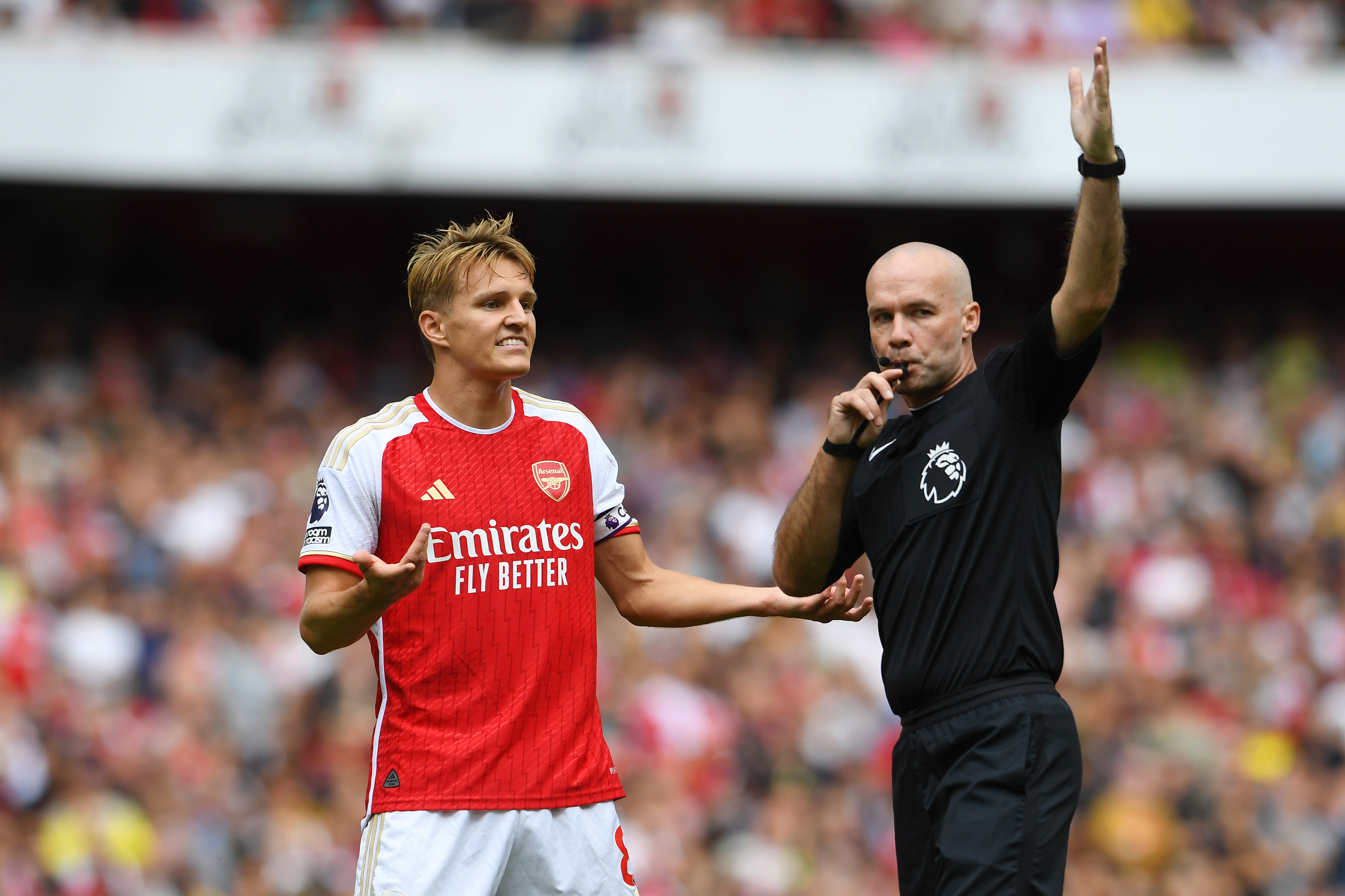 Martin Odegaard complaining to Paul Tierney