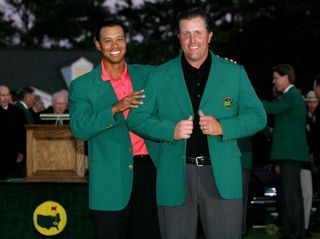 Phil Mickelson wearing the Green Jacket after Tiger Woods gave it to him
