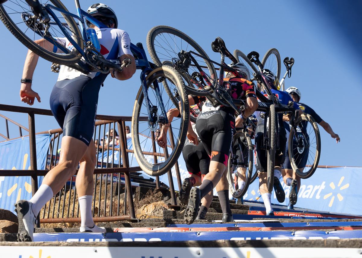 Riders in the lead group make their way up the massive flight of stairs midway through the race.