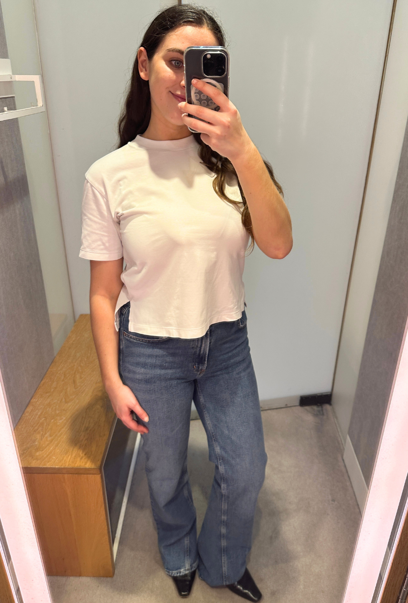 An image of Who What Wear UK SEO Writer, Ava Gilchrist, wearing Agolde bootcut jeans.