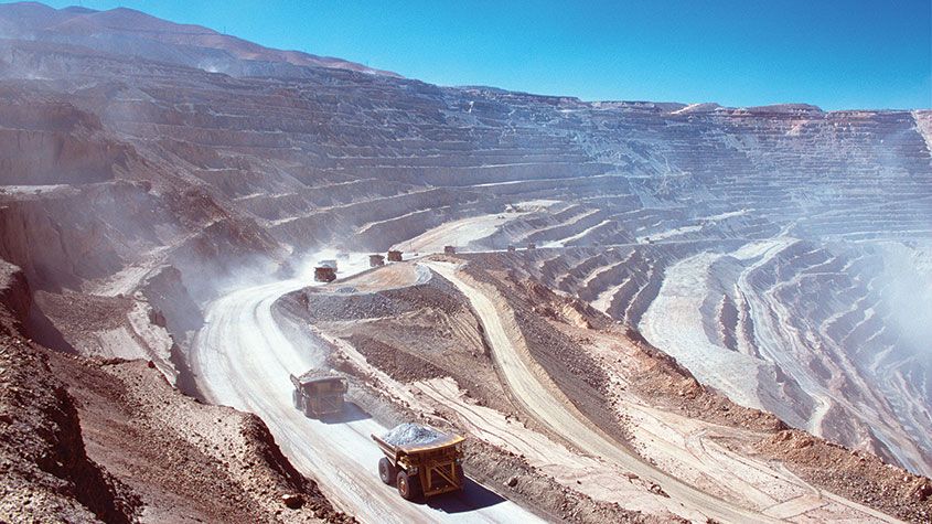 Ore trucks in an open-pit mine