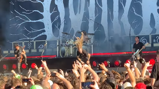 Lamb Of God's Randy Blythe appears on stage with Gojira