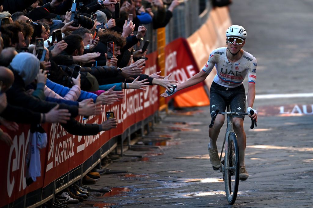 SIENA ITALY MARCH 02 Tadej Pogacar of Slovenia and UAE Team Emirates celebrates at finish line as race winner during the 18th Strade Bianche 2024 Mens Elite a 215km one day race from Siena to Siena 320m UCIWT on March 02 2024 in Siena Italy Photo by Tim de WaeleGetty Images