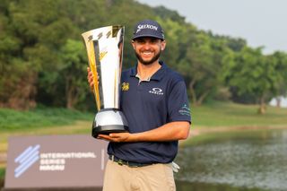 John Catlin holds the International Series Macau trophy