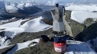 Coffee brewing on a snowy summit