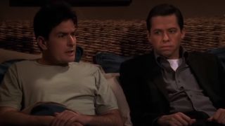 Charlie Harper (Charlie Sheen) and Alan Harper (Jon Cryer) talk in bed on Two and a Half Men