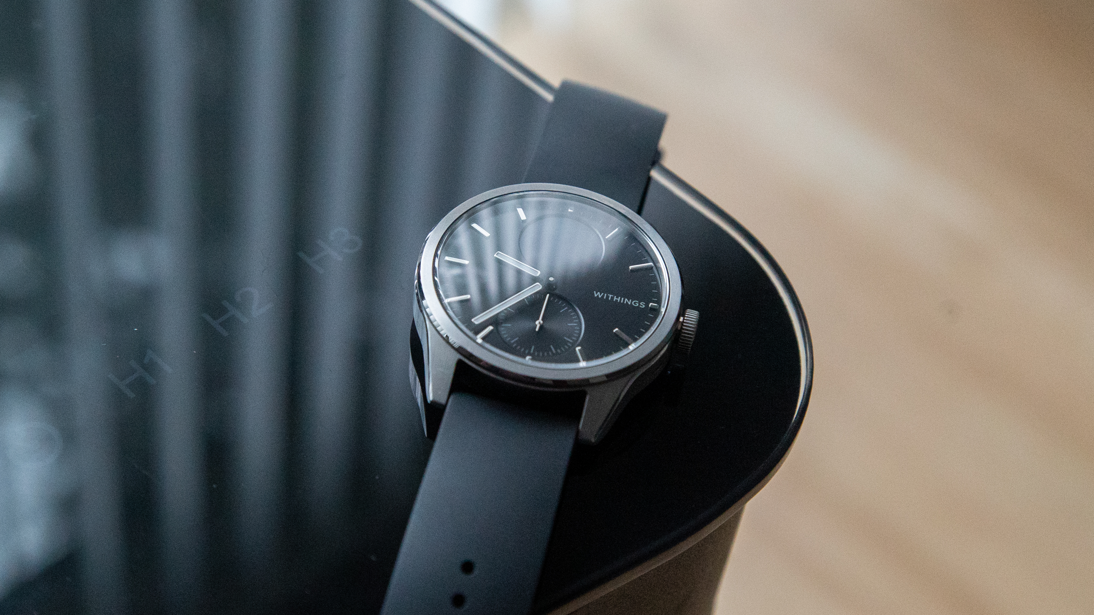 The Withings ScanWatch 2 on the corner of a desk