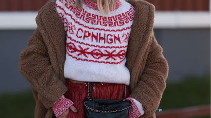 Woman in red and white fair isle jumper GettyImages-1746744015