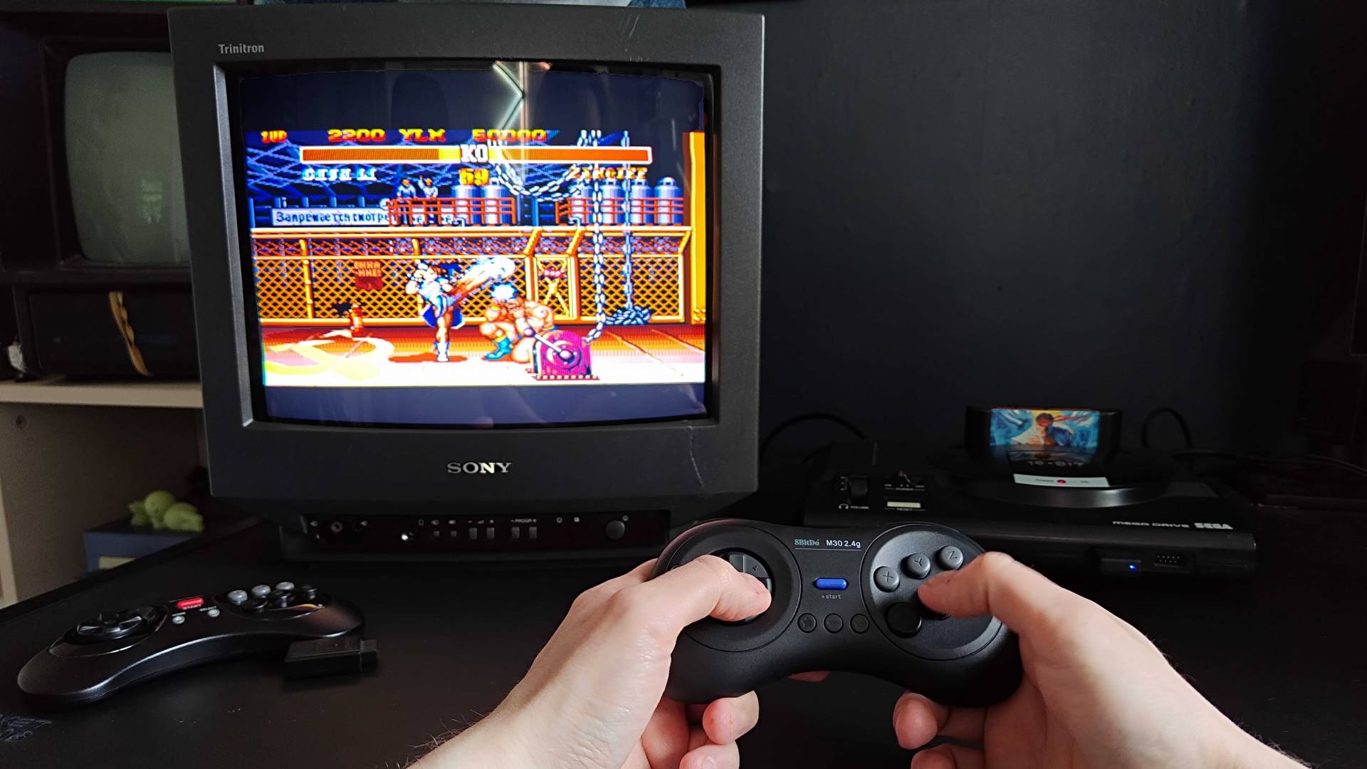 Phil Hayton using 8Bitdo M30 to play Street Fighter 2 on a Sony CRT TV using Japanese Sega Mega Drive.