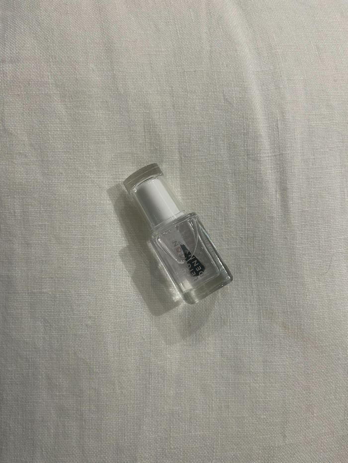 The Leighton Denny Crystal Finish Quick Dry Top Coat on a white linen background