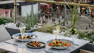 Enjoy food and drinks on the rooftop terrace