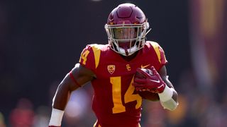 Raleek Brown #14 of the USC Trojans scores a touchdown, to take a 21-7 over the Rice Owls, during the second quarter at United Airlines Field at the Los Angeles Memorial Coliseum on September 3, 2022 in Los Angeles, California.